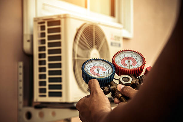 Professional Air Conditioning Service technician working in Grover, MO